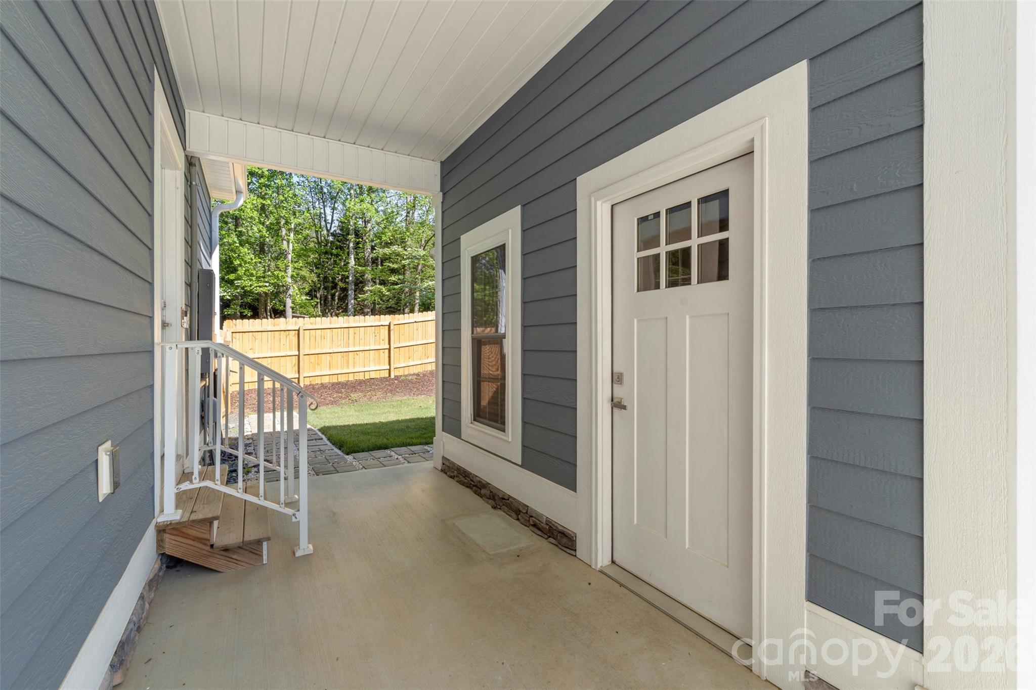 206 Montclair Drive Locust, NC 28097 - Photo 36 of 40 a view of a porch with furniture and a gate