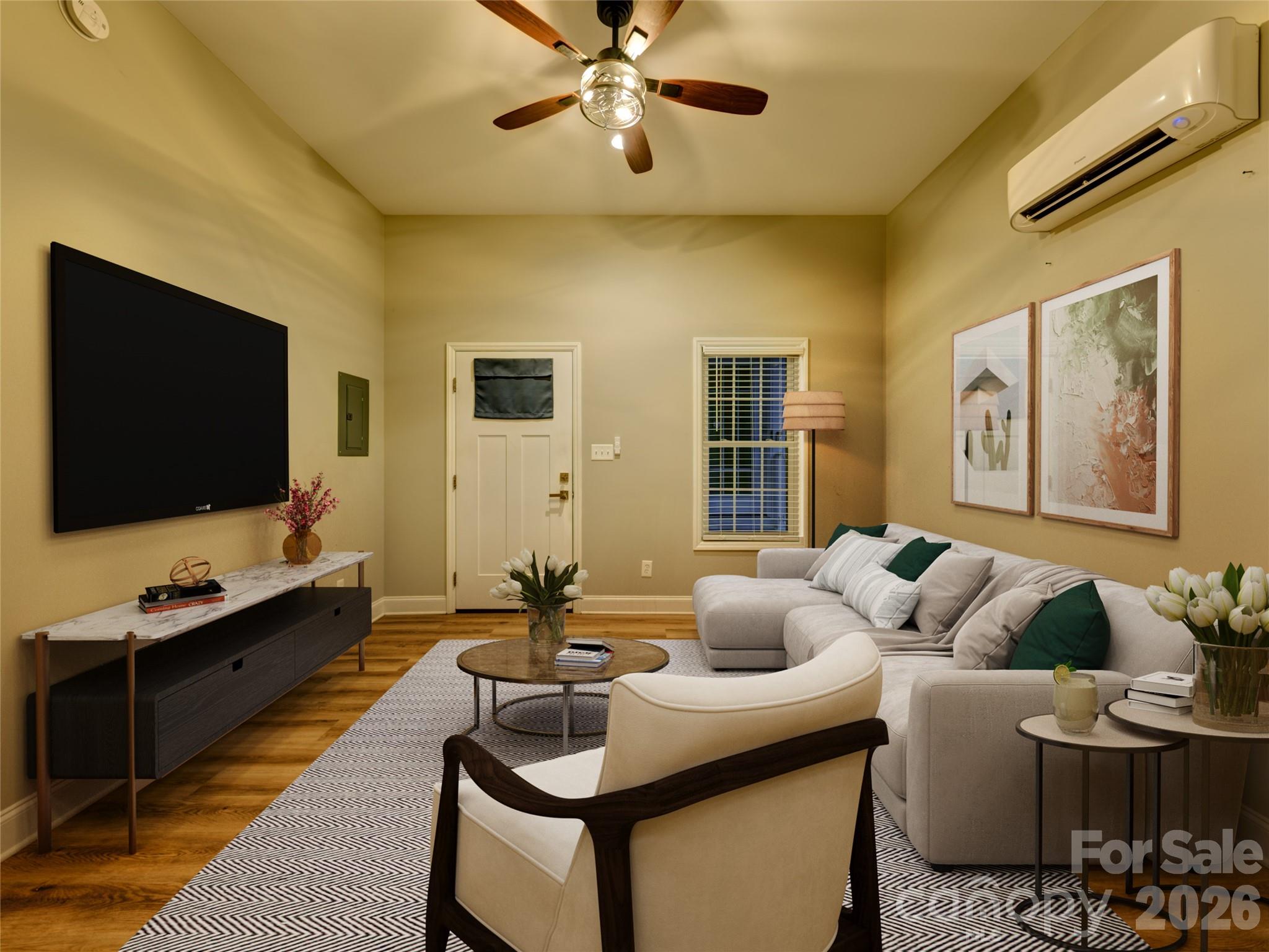 206 Montclair Drive Locust, NC 28097 - Photo 38 of 40 a living room with furniture and a flat screen tv