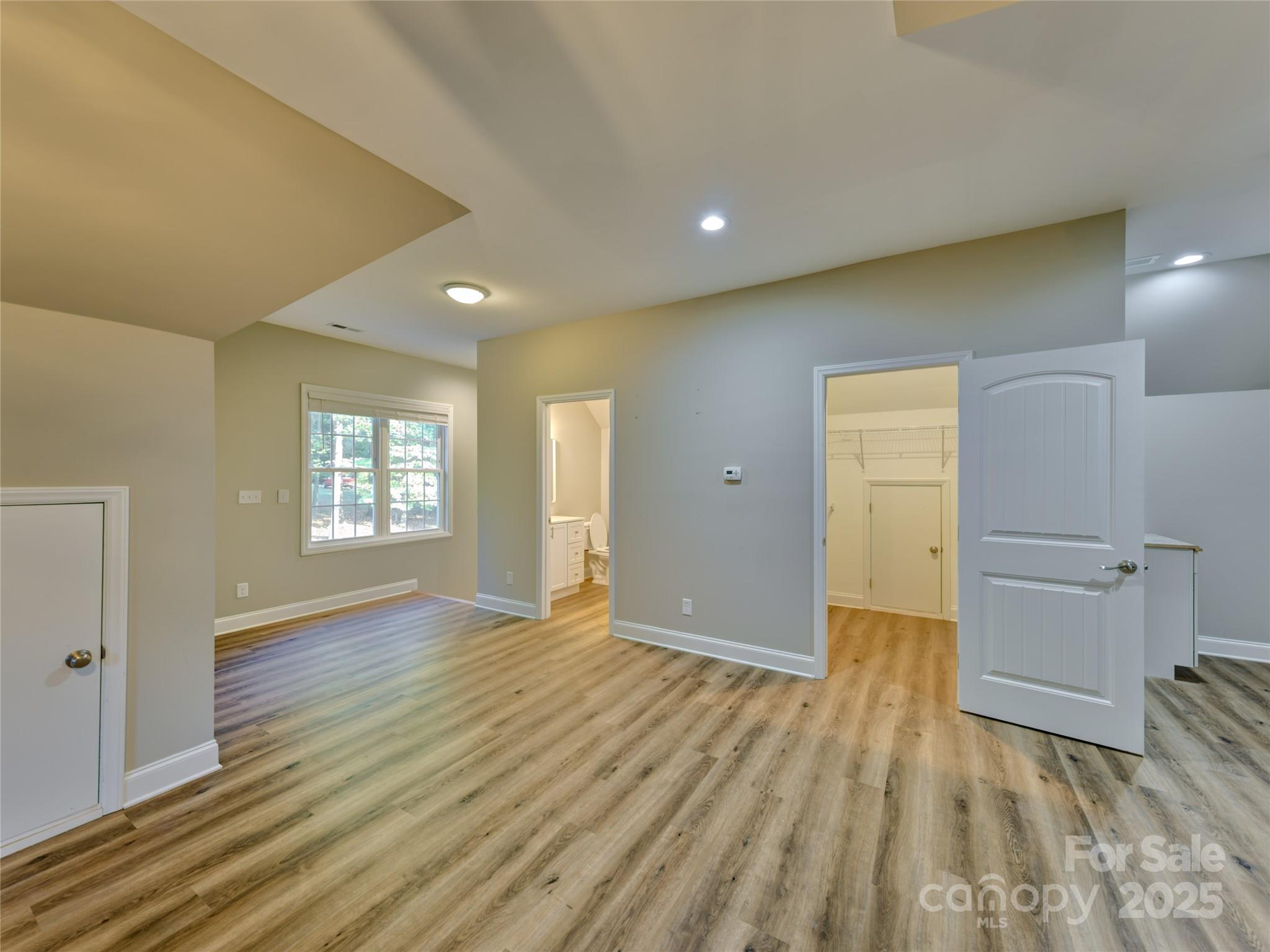 206 Montclair Drive Locust, NC 28097 - Photo 39 of 46 wooden floor in an empty room with a window