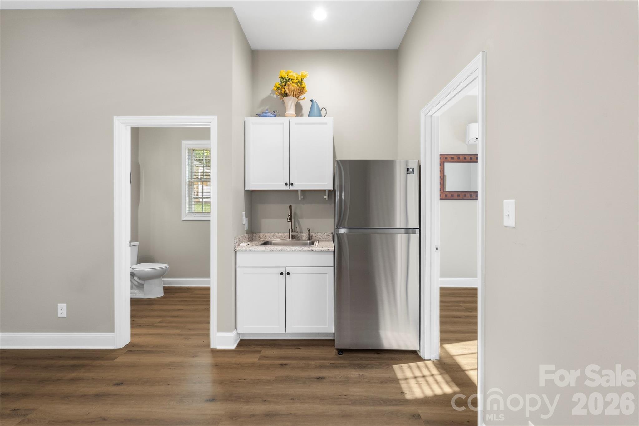 206 Montclair Drive Locust, NC 28097 - Photo 39 of 40 a kitchen with stainless steel appliances a refrigerator sink and cabinets