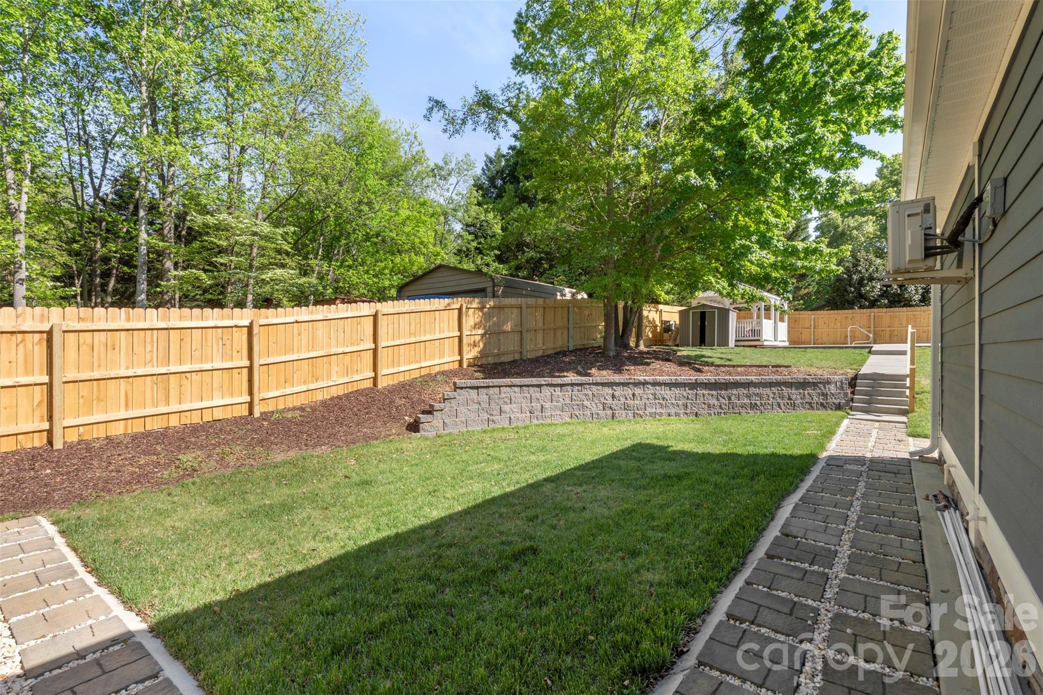206 Montclair Drive Locust, NC 28097 - Photo 5 of 40 a view of a backyard with sitting area