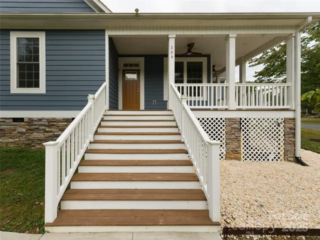 a view of a backyard with swimming pool