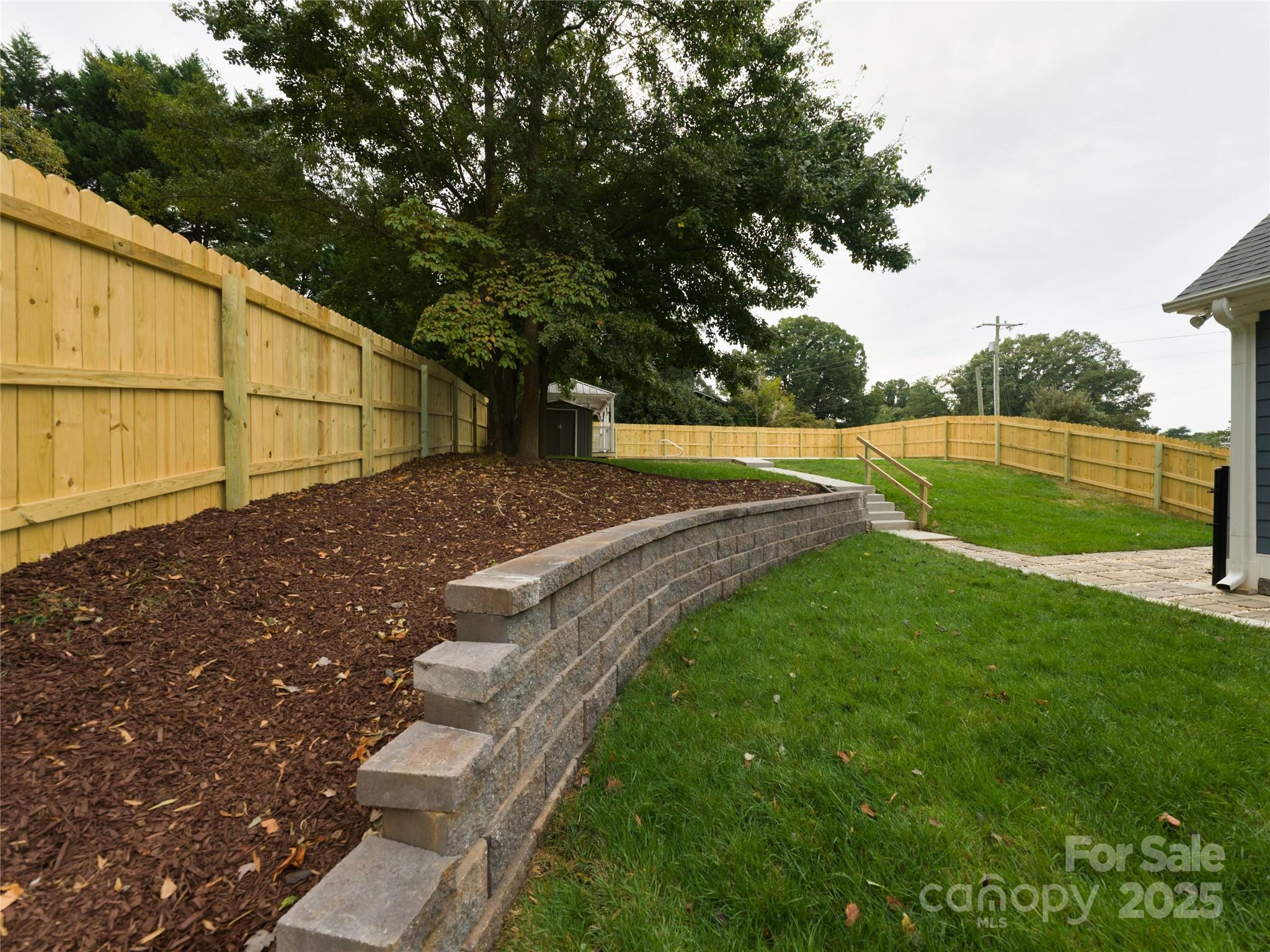 206 Montclair Drive Locust, NC 28097 - Photo 10 of 46 a view of a backyard with swimming pool