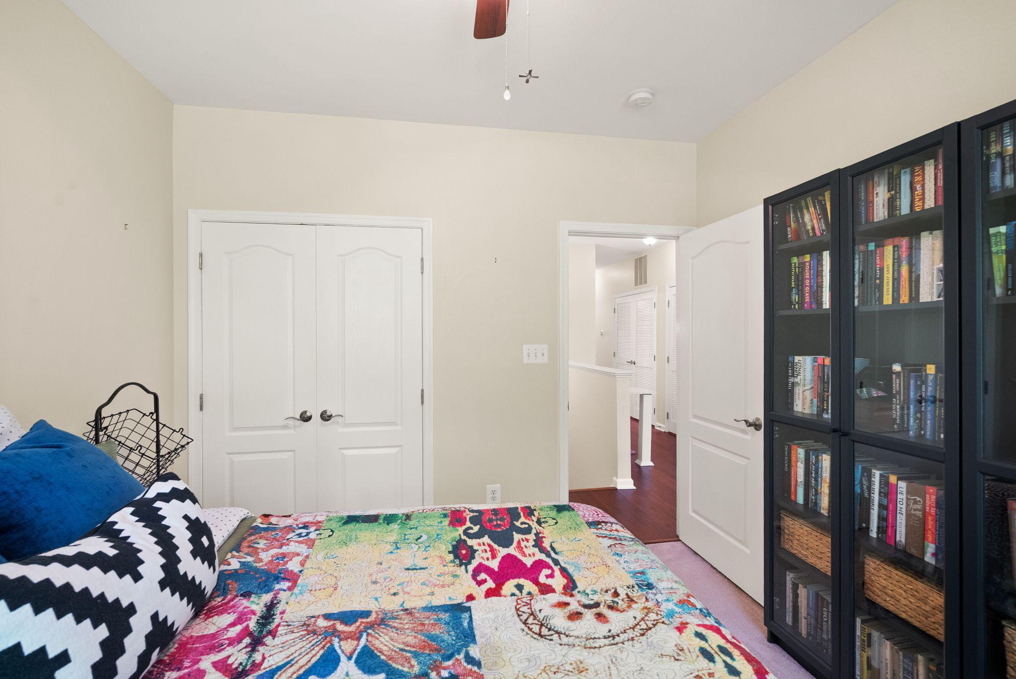 12414 A Liberty Bridge Road Fairfax, VA 22033 - Photo 26 of 38 a bedroom with bed and book shelf