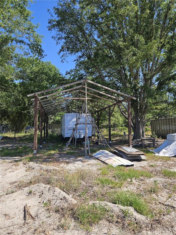 0 Southwest Mixson Road Lake City, FL 32024 - Photo 28 of 34 a backyard of a house with barbeque oven table and chairs