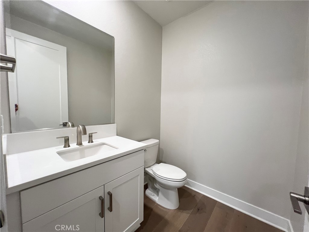 108 Chorus Irvine, CA 92618 - Photo 13 of 39 a bathroom with a sink a toilet and mirror