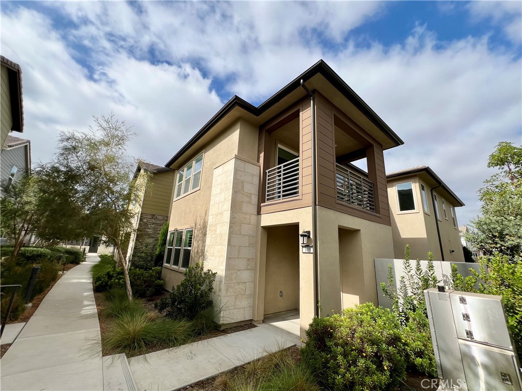 108 Chorus Irvine, CA 92618 - Photo 2 of 39 a front view of a house with garden