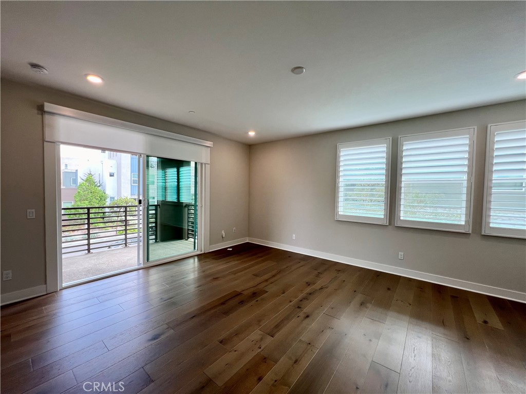 108 Chorus Irvine, CA 92618 - Photo 21 of 39 an empty room with wooden floor and windows