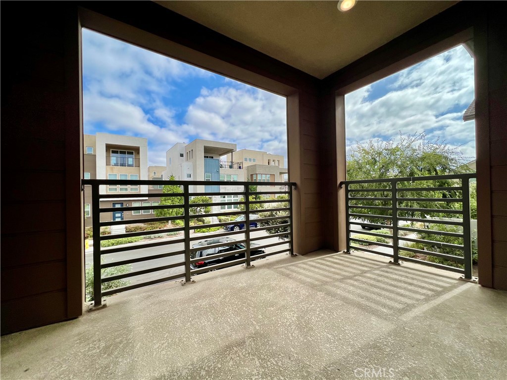 108 Chorus Irvine, CA 92618 - Photo 22 of 39 a view of a balcony with floor to ceiling windows and stairs