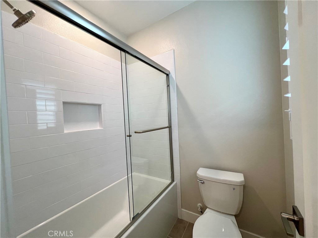 108 Chorus Irvine, CA 92618 - Photo 27 of 39 a bathroom with a toilet and a shower