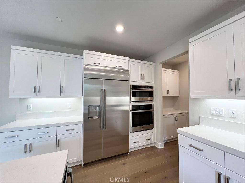 108 Chorus Irvine, CA 92618 - Photo 10 of 39 a kitchen with a refrigerator sink and cabinets