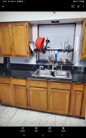 a kitchen with stainless steel appliances granite countertop a sink and cabinets