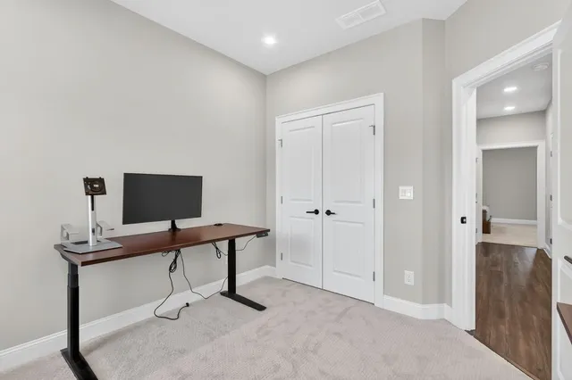 a view of a workspace with furniture