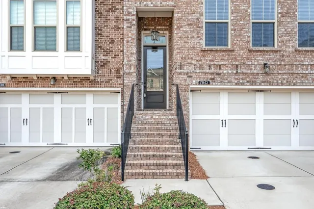 a view of a brick building with many windows
