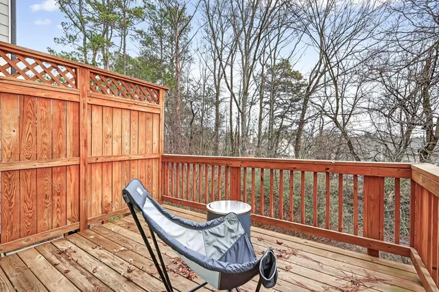 a view of balcony with wooden floor and outdoor seating