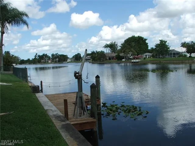 a view of a lake with a house in the background