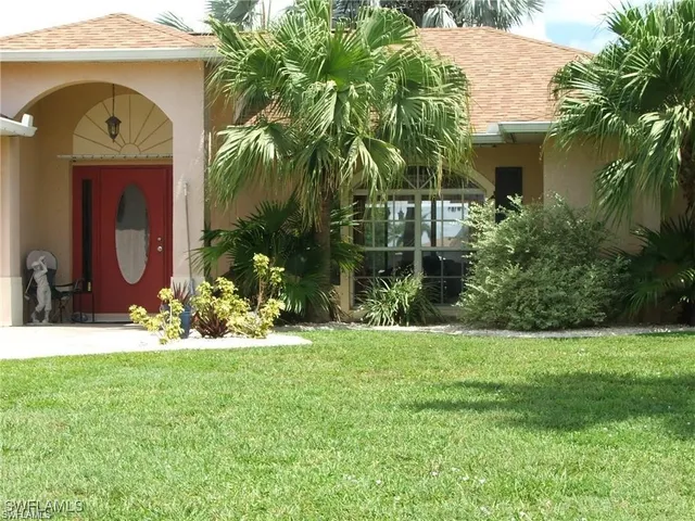 a view of a house with a garden