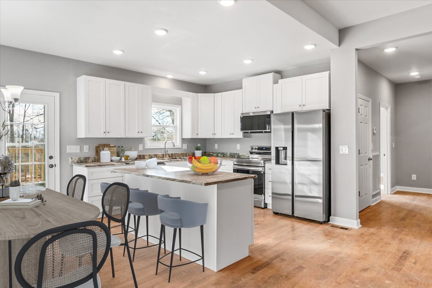 206 Daley Street Summertown, TN 38483 - Photo 4 of 16 a kitchen with stainless steel appliances granite countertop a refrigerator a stove a sink a dining table and chairs