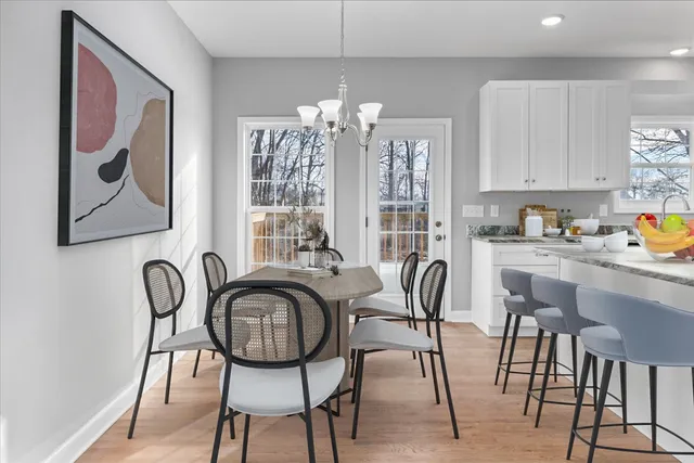 a dining room with furniture and window