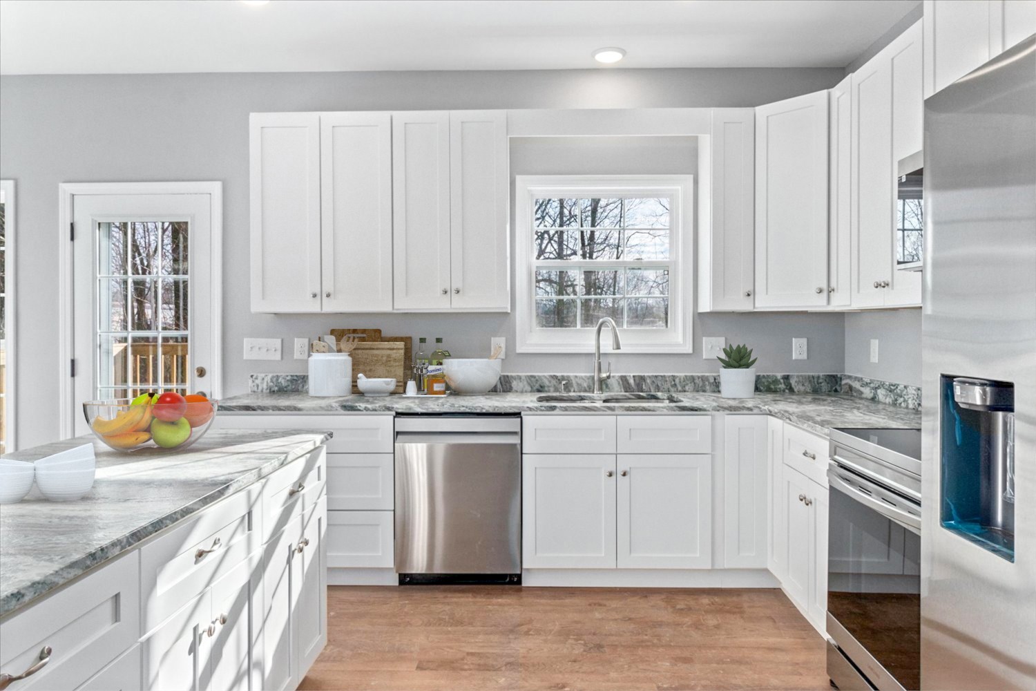 206 Daley Street Summertown, TN 38483 - Photo 7 of 16 a kitchen with stainless steel appliances granite countertop a sink stove and refrigerator