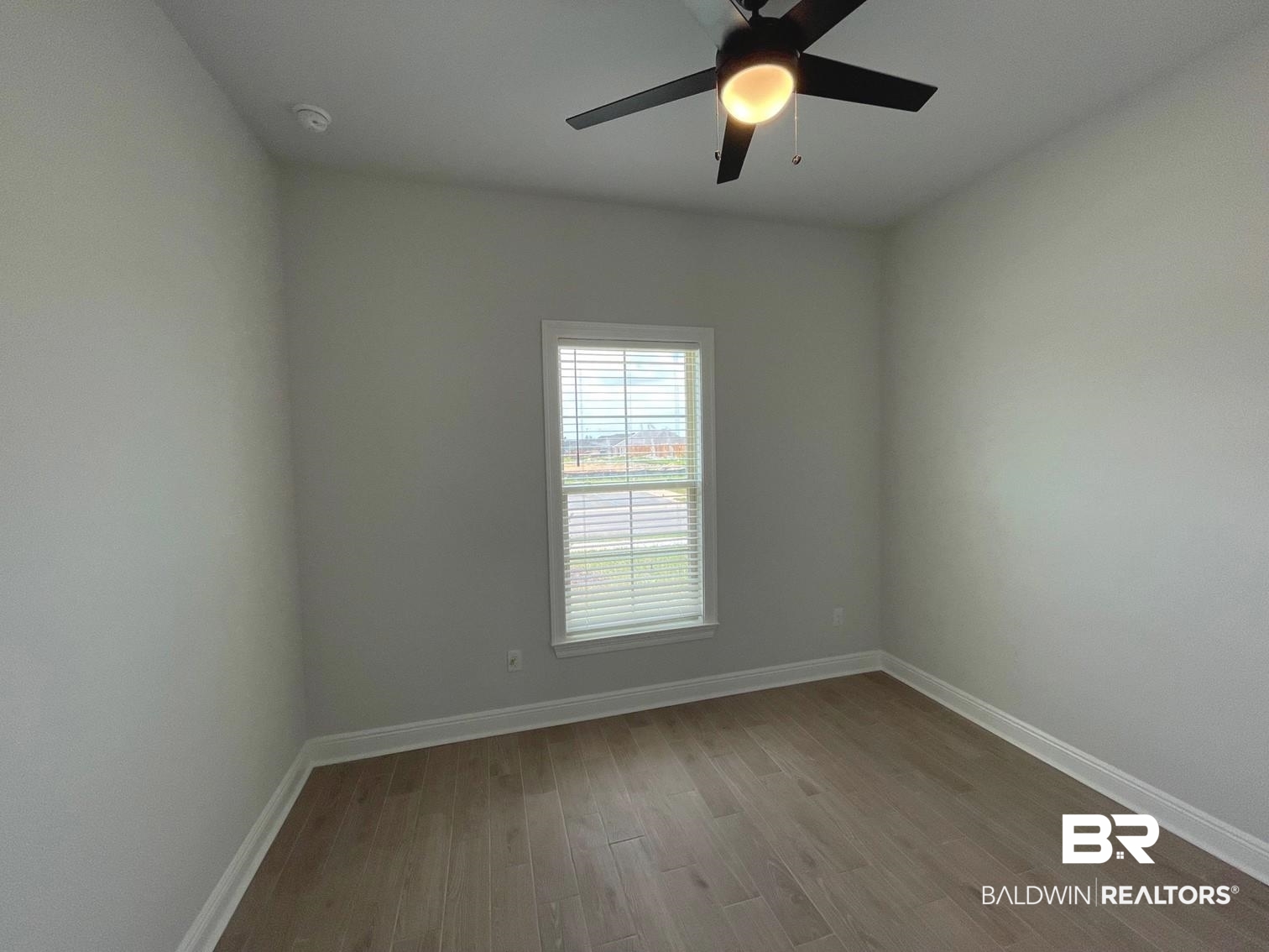 1626 Fenton Circle Foley, AL 36535 - Photo 11 of 16 Spare room featuring wood-type flooring and ceiling fan
