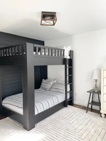 a bedroom with a bed and a table