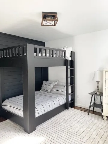 a bedroom with a bed and a table