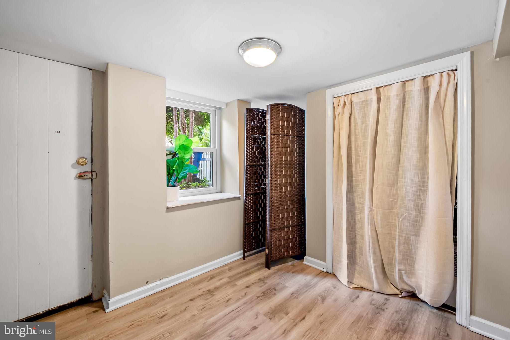 3432 Roland Avenue Baltimore, MD 21211 - Photo 26 of 28 lower level walk out with closet and sump pump