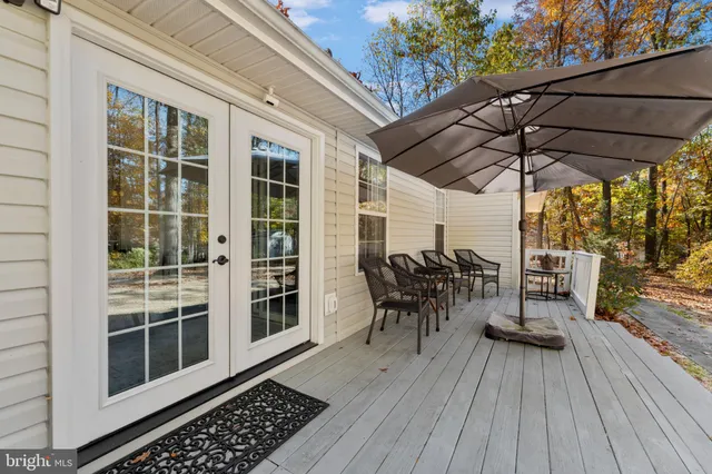 deck with table and chairs