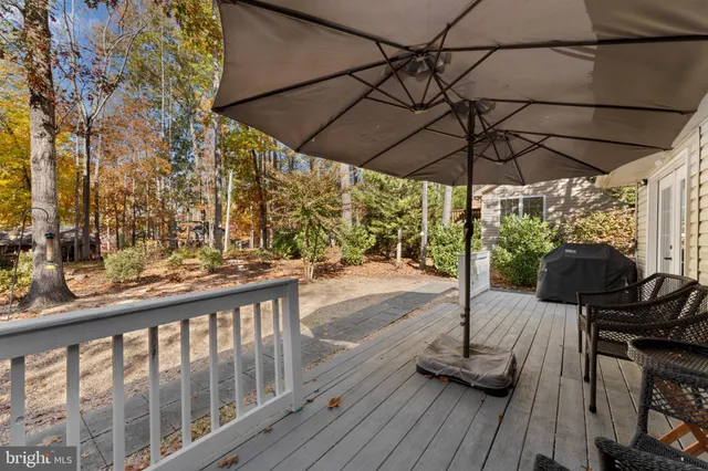 a view of balcony with wooden floor and outdoor seating