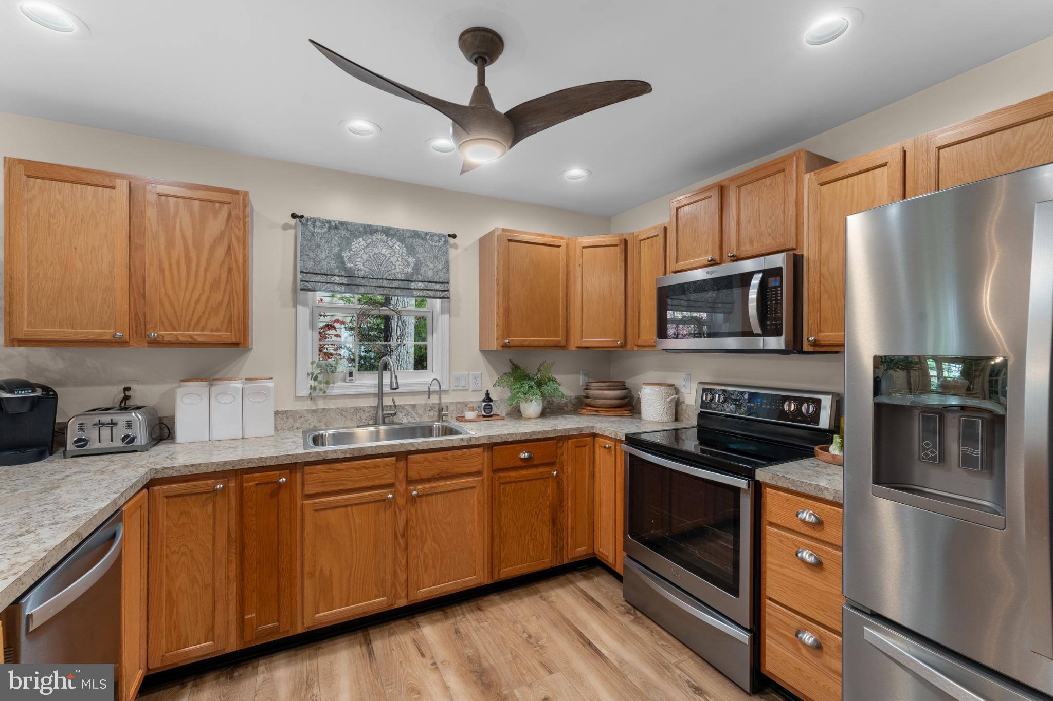 214 Monument Road Locust Grove, VA 22508 - Photo 16 of 48 Modern kitchen with warm wood cabinetry.