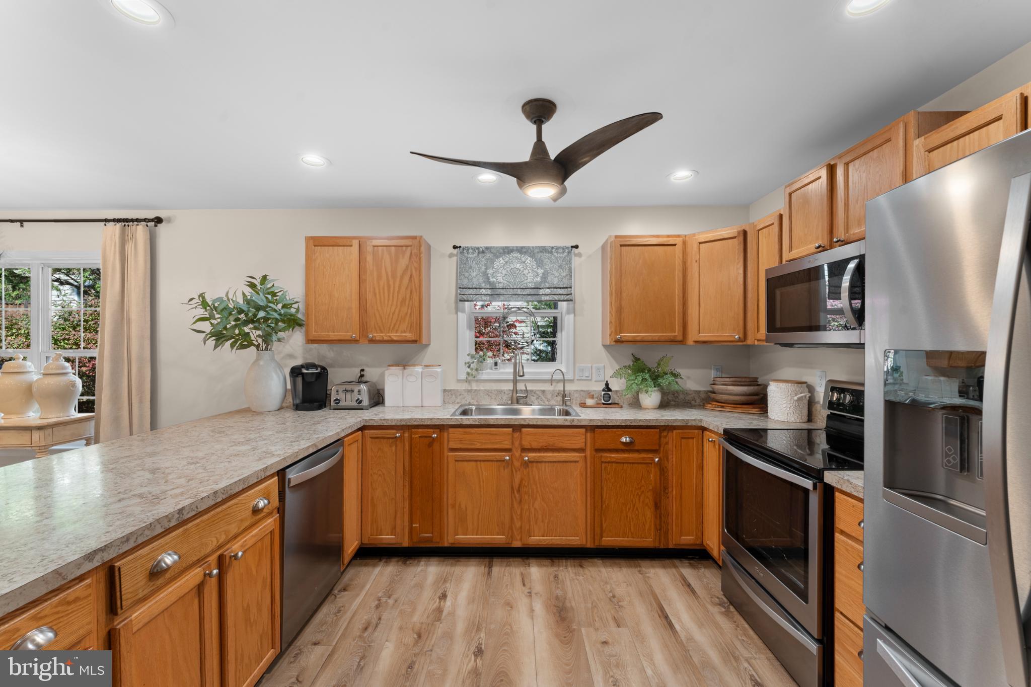 214 Monument Road Locust Grove, VA 22508 - Photo 17 of 48 Modern kitchen with warm wood accents.