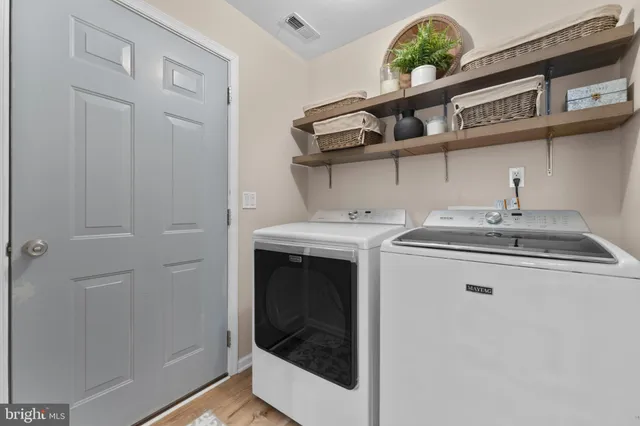a utility room with a sink a washer and dryer