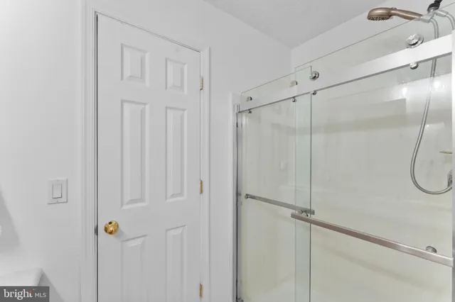 a spacious bathroom with a granite countertop sink and a mirror