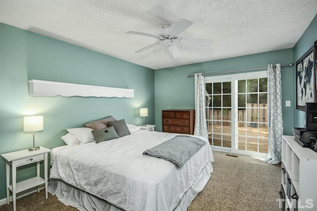 5863 Branchwood Road Raleigh, NC 27609 - Photo 15 of 30 a bedroom with a bed and a television