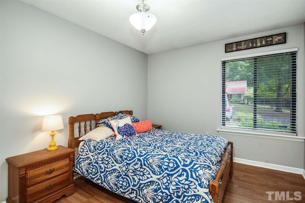 5863 Branchwood Road Raleigh, NC 27609 - Photo 19 of 30 a bedroom with a bed and a window