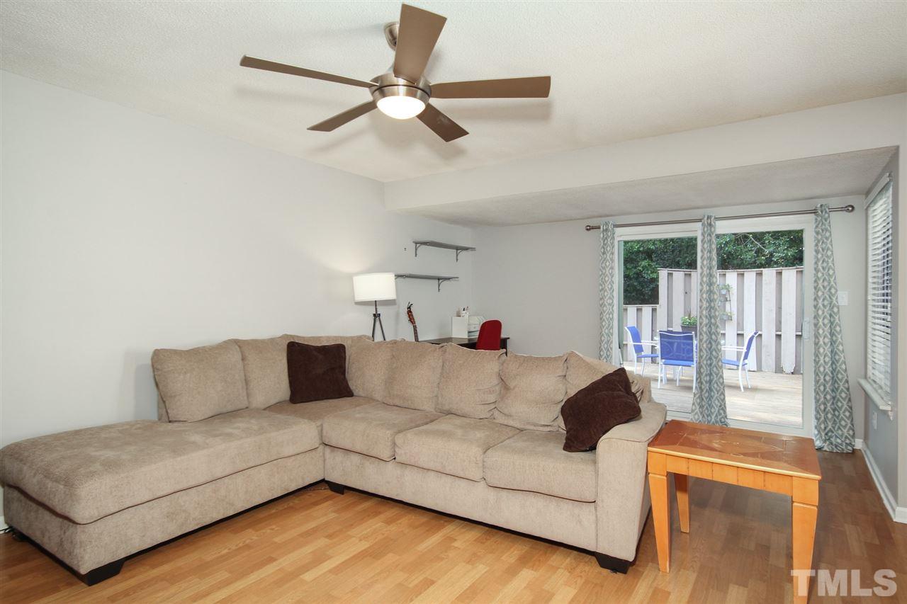 5863 Branchwood Road Raleigh, NC 27609 - Photo 5 of 30 a living room with furniture and a large window