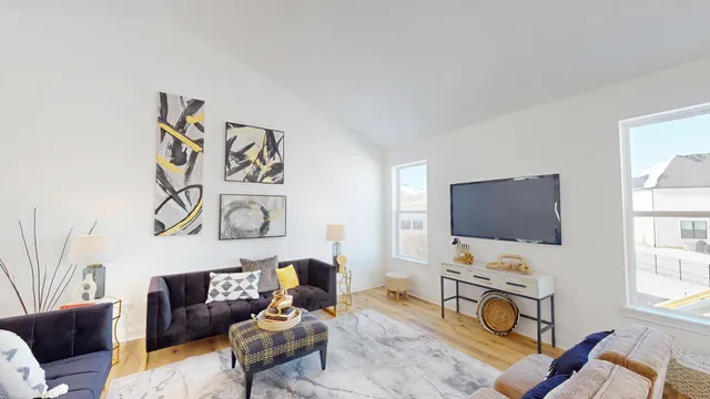 a living room with furniture and a flat screen tv