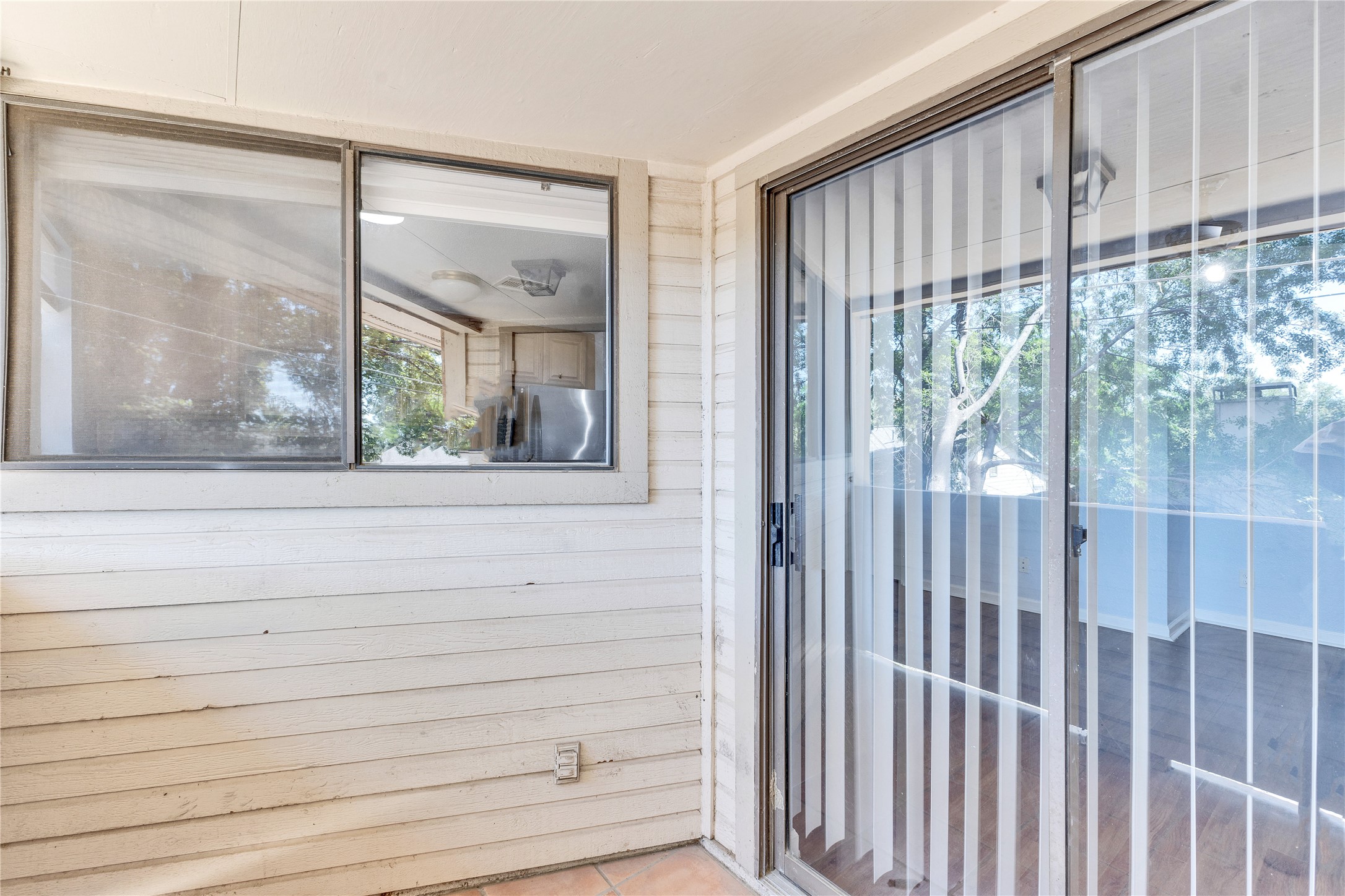 2500 Burleson Road, Unit 703 Austin, TX 78741 - Photo 17 of 24 A private outdoor patio connects seamlessly to the indoor living spaces through glass doors.
