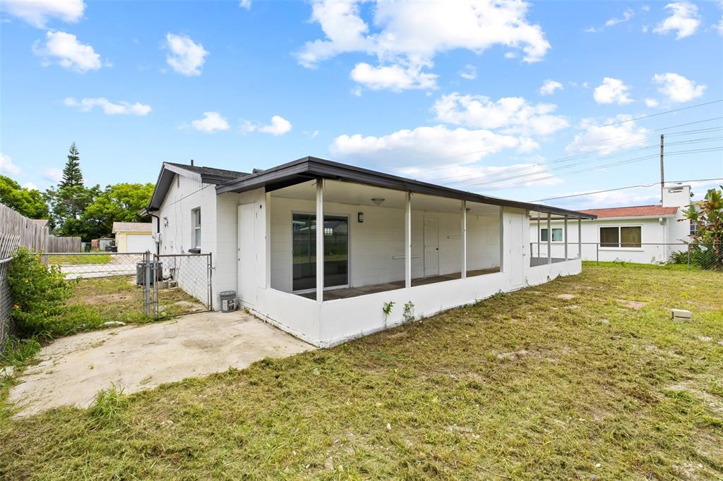8046 Norwich Drive Port Richey, FL 34668 - Photo 27 of 31 a view of a house with a garden and yard