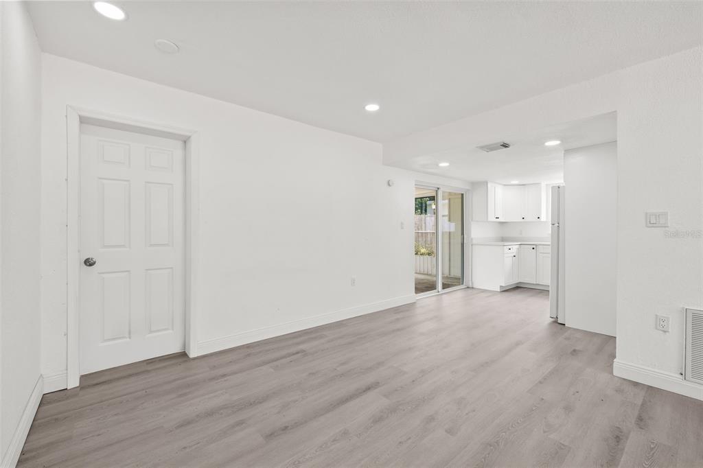 8046 Norwich Drive Port Richey, FL 34668 - Photo 10 of 31 a view of an empty room with a kitchen