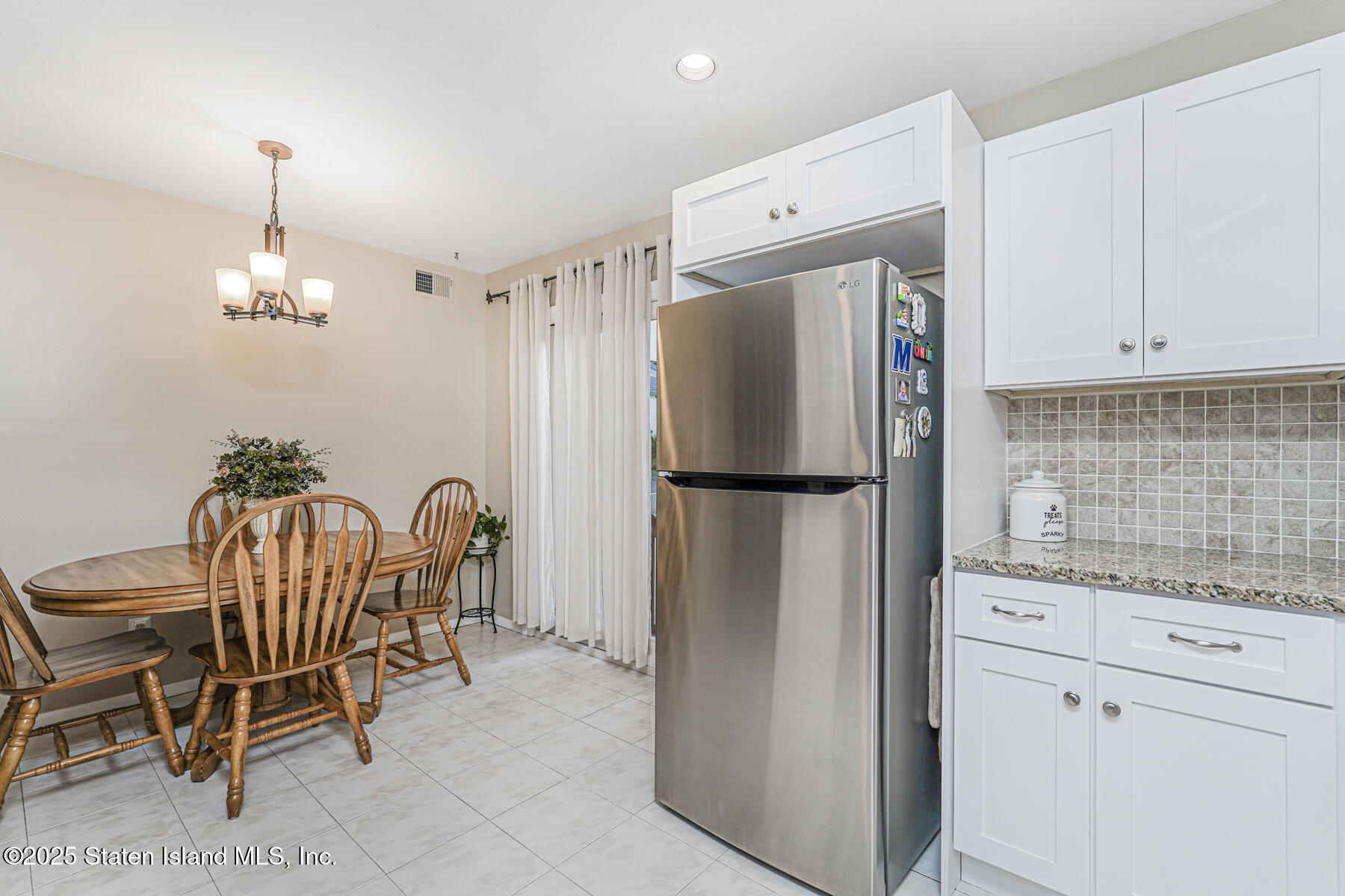 342 Chelsea Street Staten Island, NY 10307 - Photo 13 of 35 a kitchen with stainless steel appliances granite countertop a refrigerator and a sink