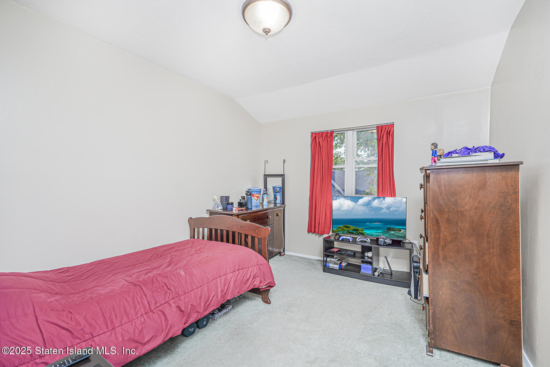 342 Chelsea Street Staten Island, NY 10307 - Photo 20 of 35 a bedroom with furniture and a flat screen tv