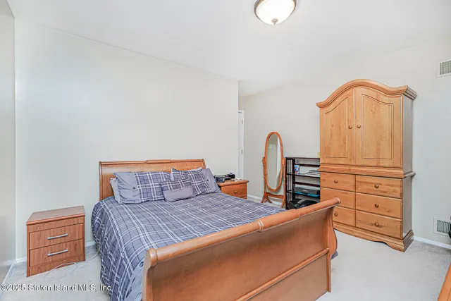 a bedroom with furniture and natural light
