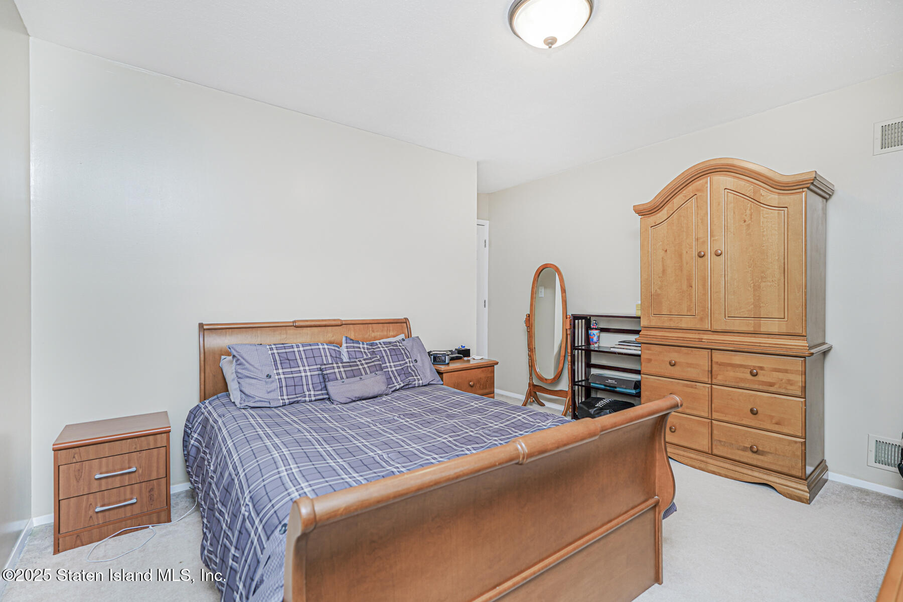 342 Chelsea Street Staten Island, NY 10307 - Photo 21 of 35 a bedroom with furniture and natural light