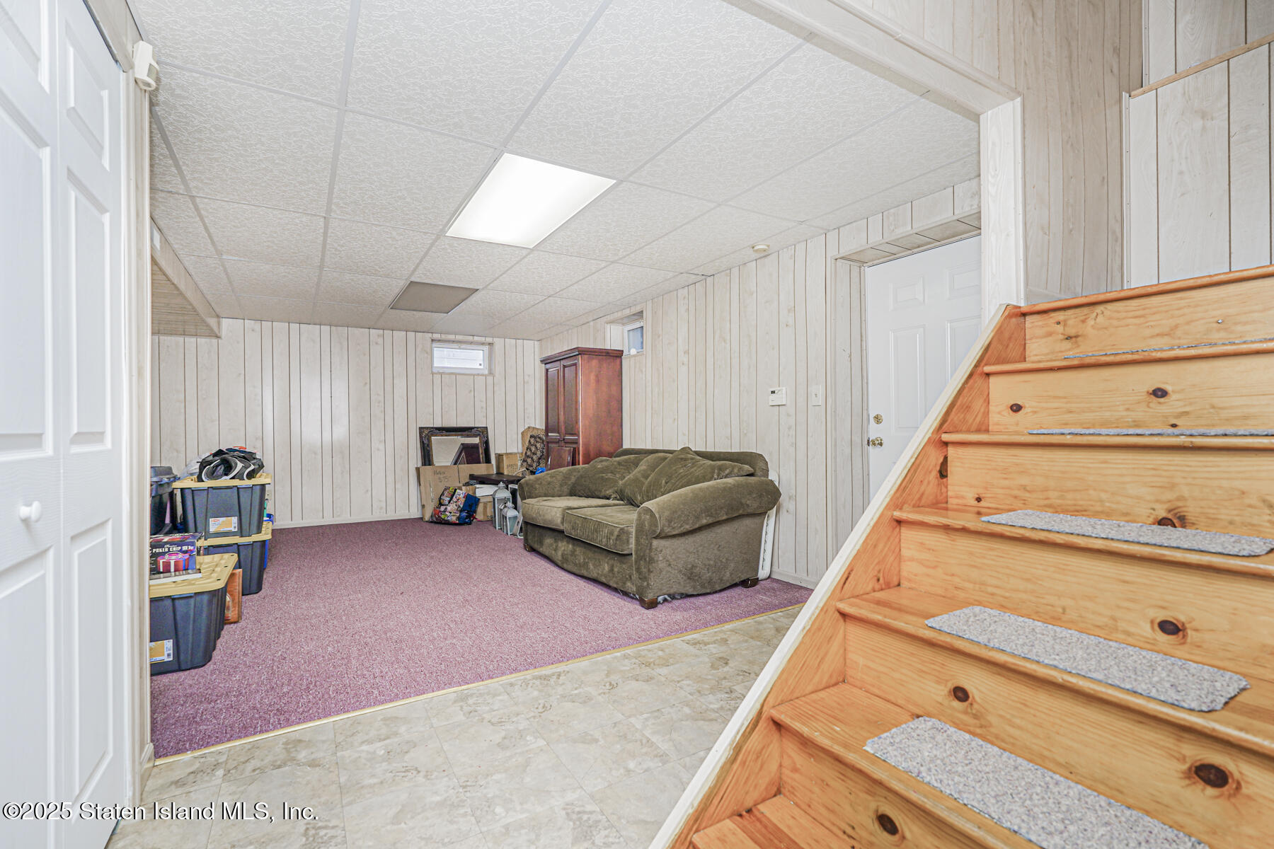 342 Chelsea Street Staten Island, NY 10307 - Photo 23 of 35 a living room with furniture and stairs