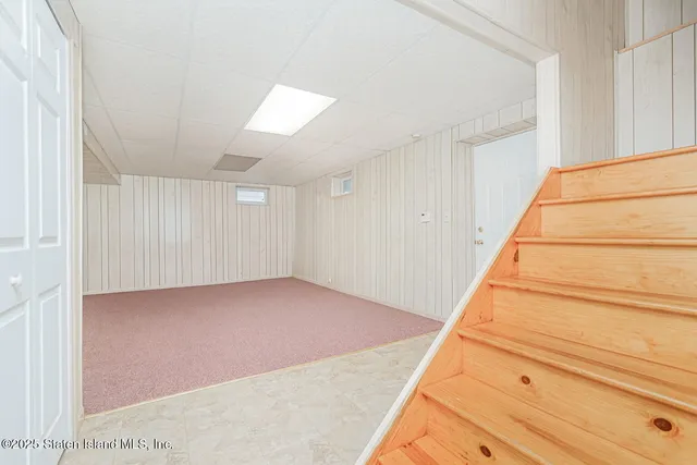 a view of an empty room with stairs