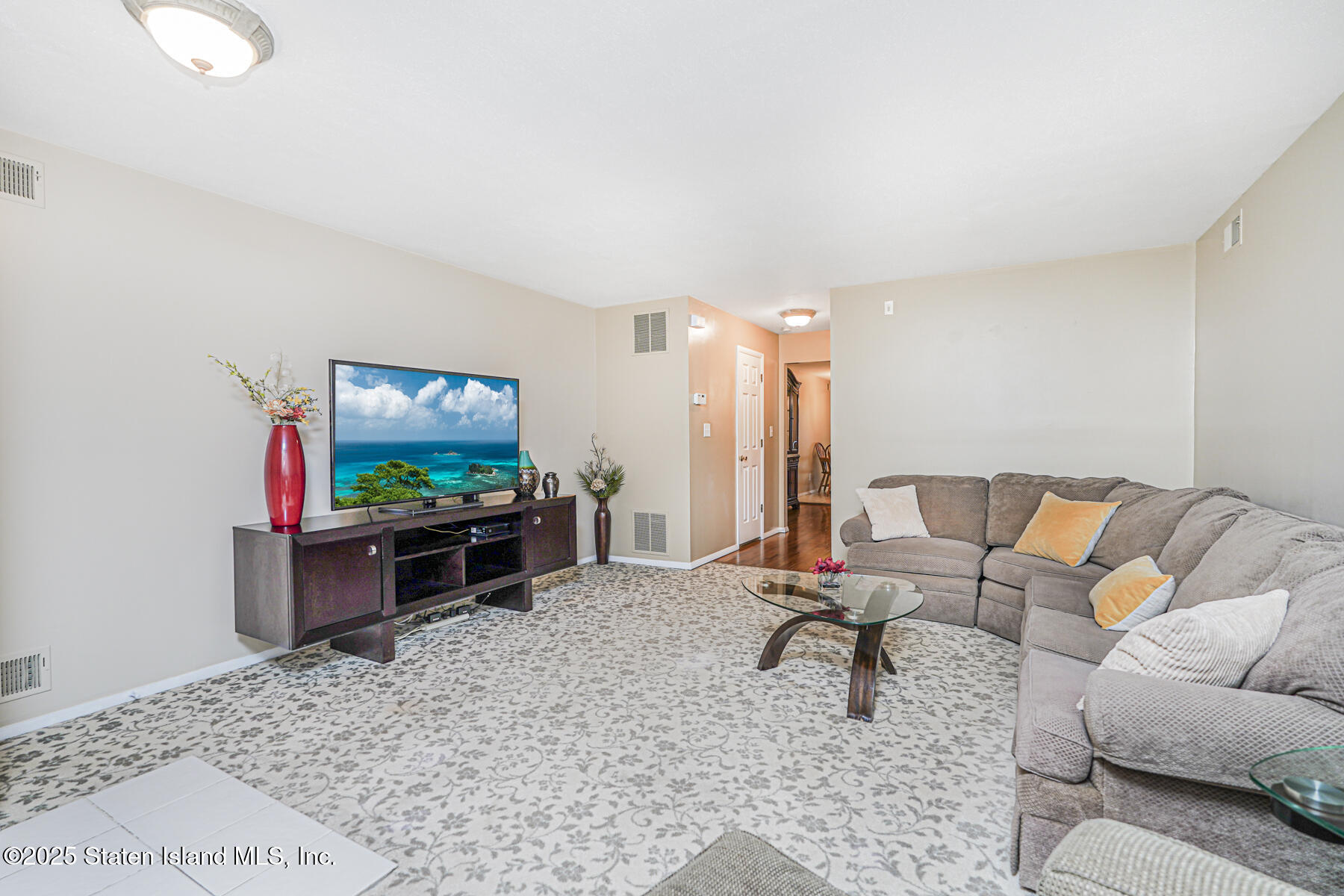 342 Chelsea Street Staten Island, NY 10307 - Photo 4 of 35 a living room with furniture and a flat screen tv