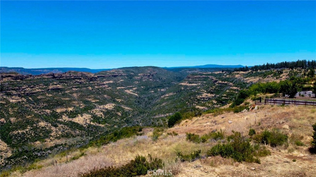 174 Valley Ridge Drive Paradise, CA 95969 - Photo 2 of 8 a view of a lake with mountains in the background