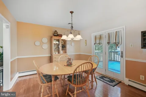 a dining room with furniture and window